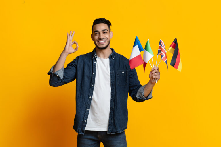 Handsome arab guy showing bunch of flags and okay gesture